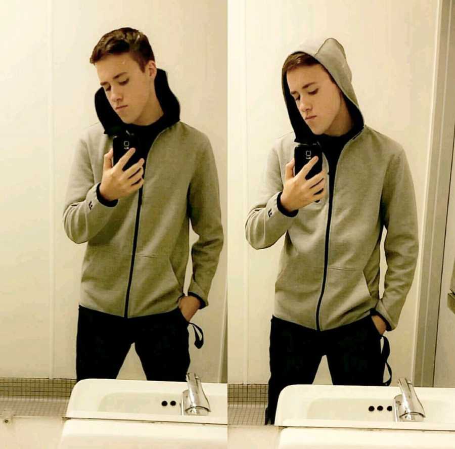 Teen in gray hoodie who lost weight and applied to air force takes mirror selfie with hood up and hood down