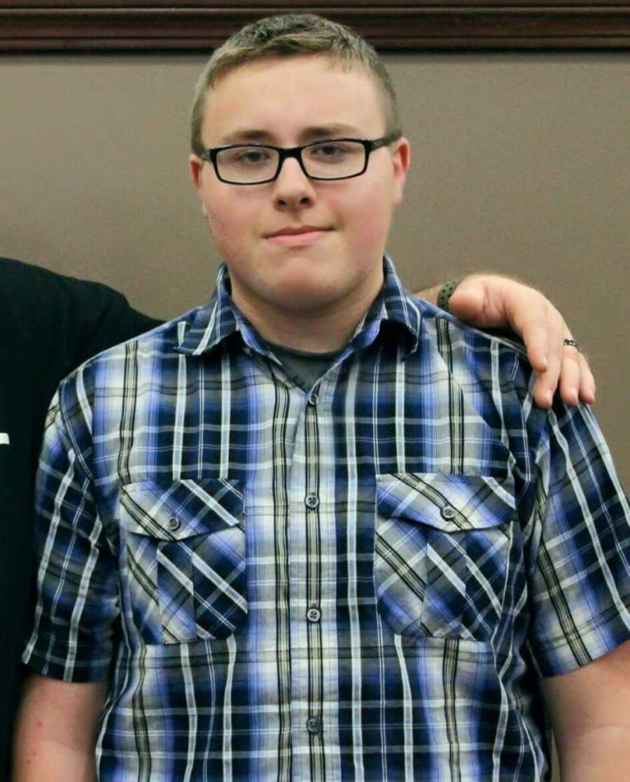 Close up of teen boy who felt overweight smiling