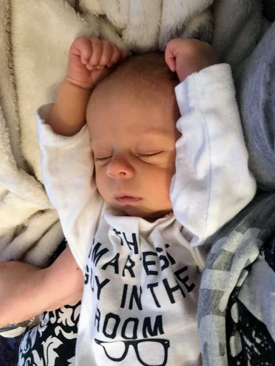 Baby sleeping with arms above his head like he did in ultrasound