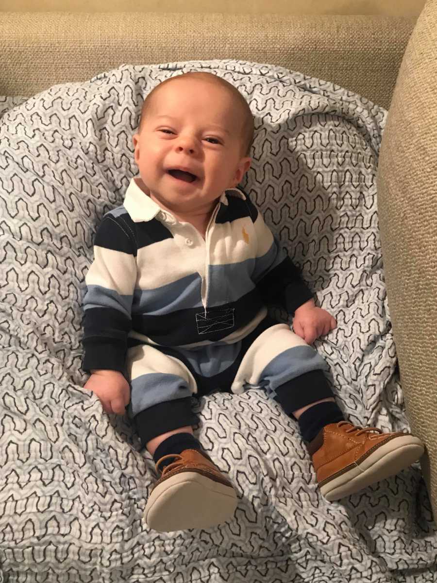 Baby who sleeps in same position he did in ultrasound sits up in bean bag smiling