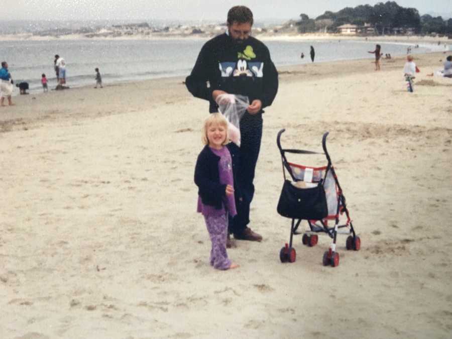 Father who will later suffer from dementia standing next to stroller and daughter on beach