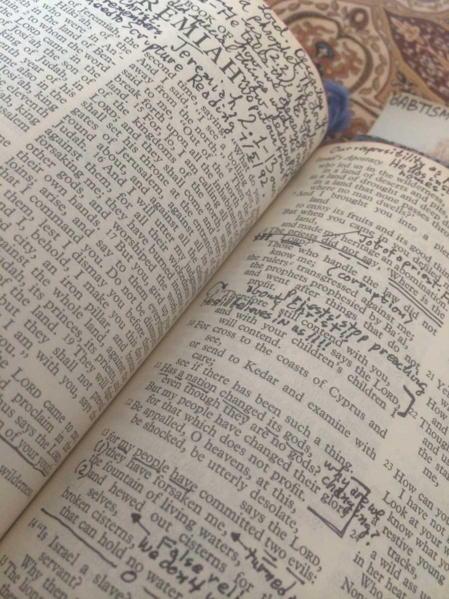 Close up of bible with notes written in margins
