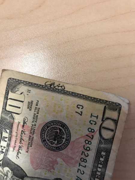 $10 bill that has the name Chad written on it which was woman's deceased husband's name