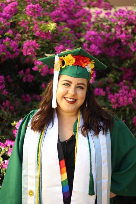 Young woman in cap and gown after graduation college even though scholarships were taken away