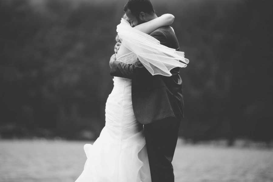 Bride and groom embrace on their wedding day 