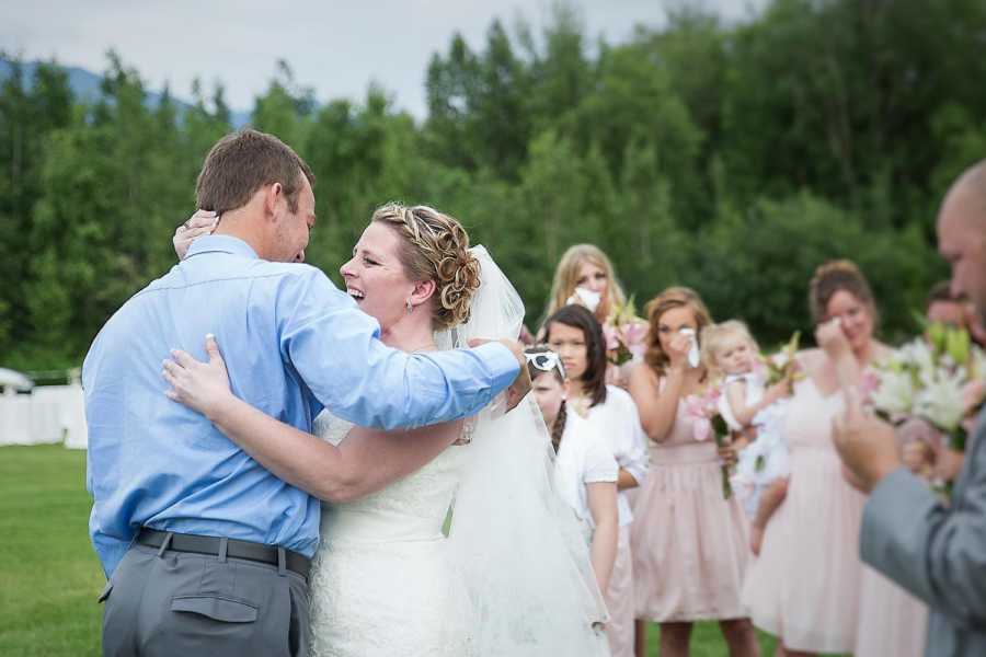 Bride hugs man who has her late son's heart while bridal party watches and cries