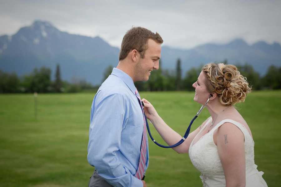 Bride smiles while listening to man's heart that once belonged to her late son with stethoscope