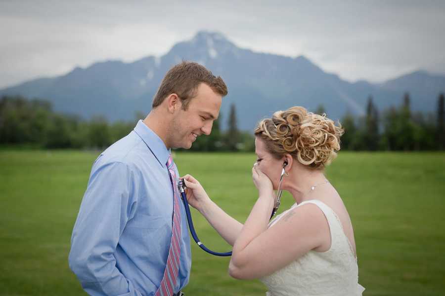 Bride holds hand over mouth as she listens to man's heart that once was her late son's with stethoscope