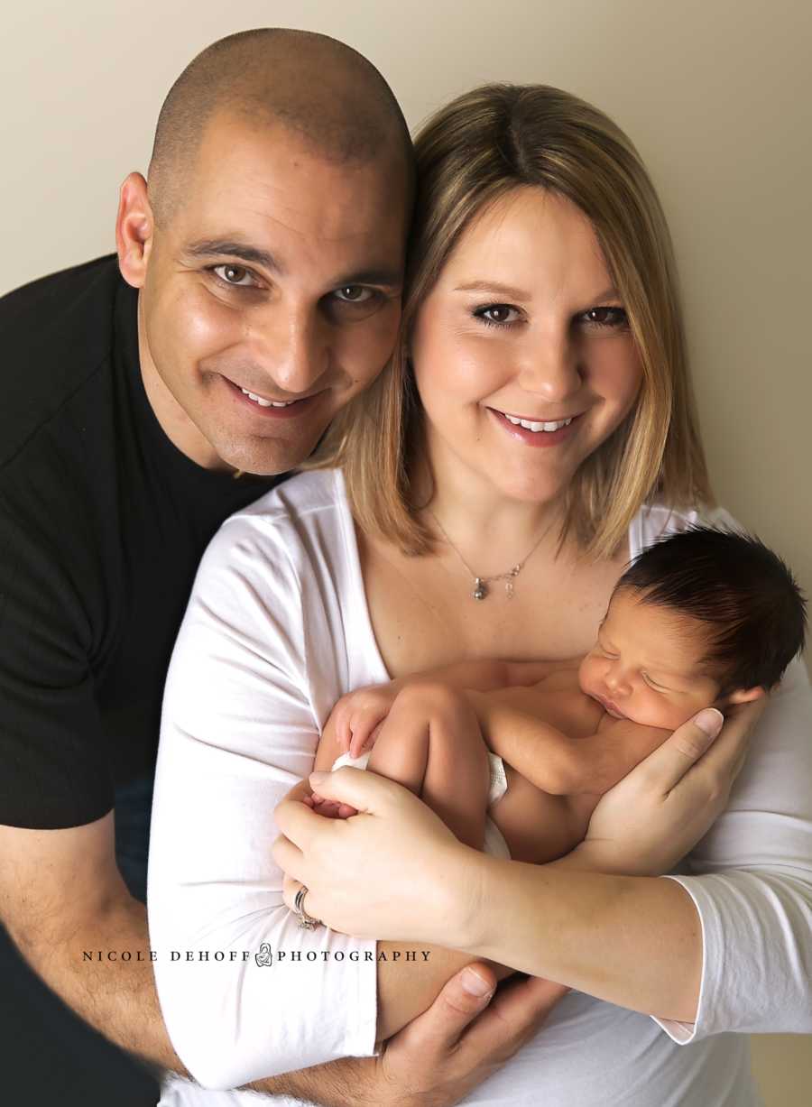 Mother and father hold newborn son after their first born was stillborn 