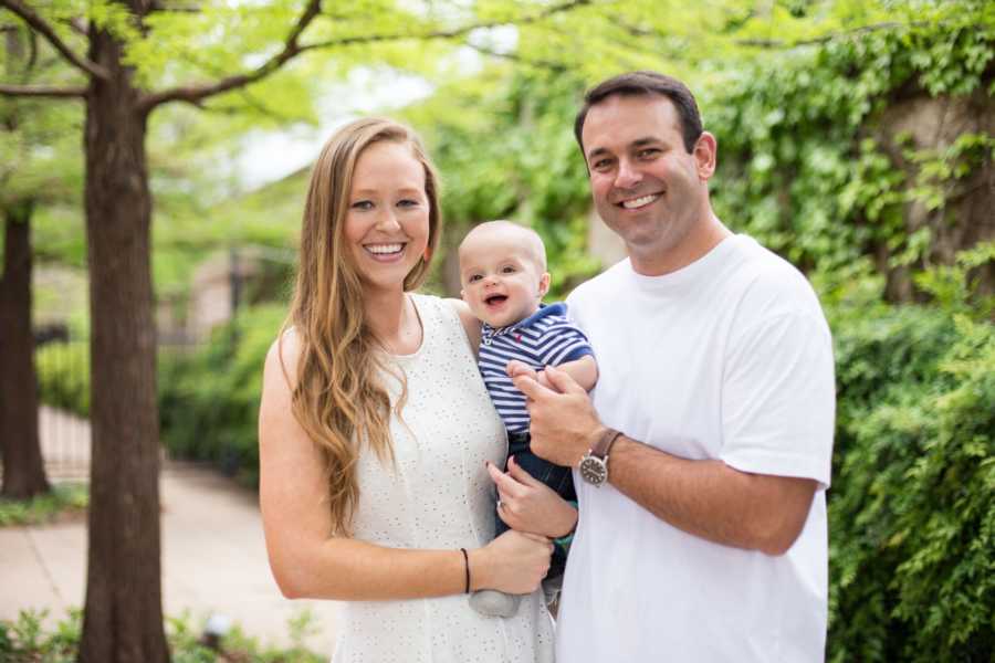 Husband and wife hold adopted baby who suffered from meth withdrawals