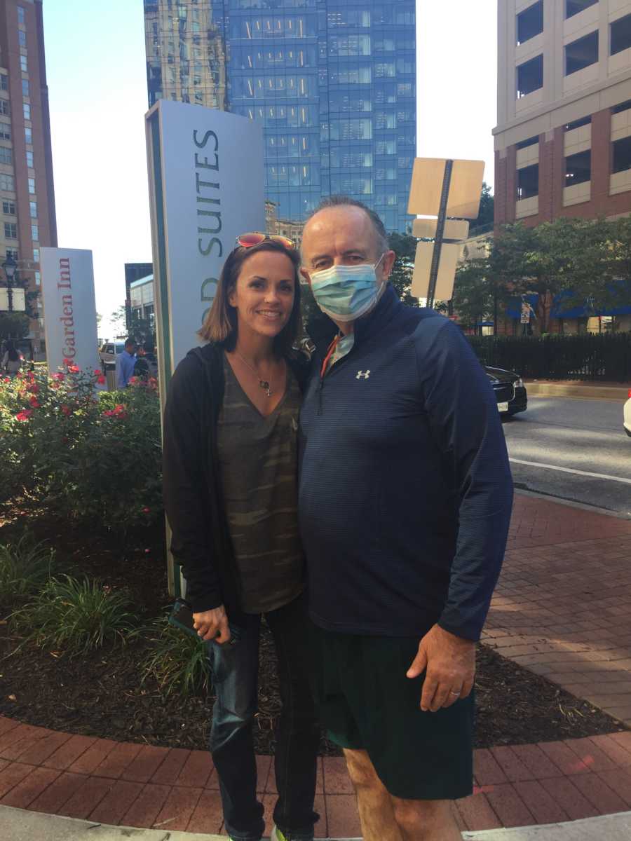 Man who needed kidney transplant stands outside with donor who is wife's friend