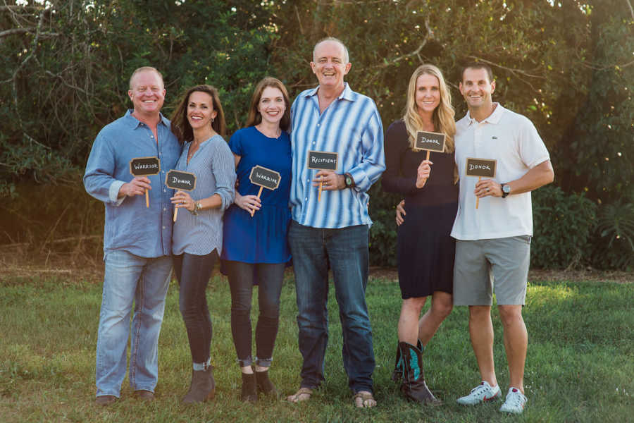 Woman who donated kidney stands with her husband beside friend and her husband next to another couple