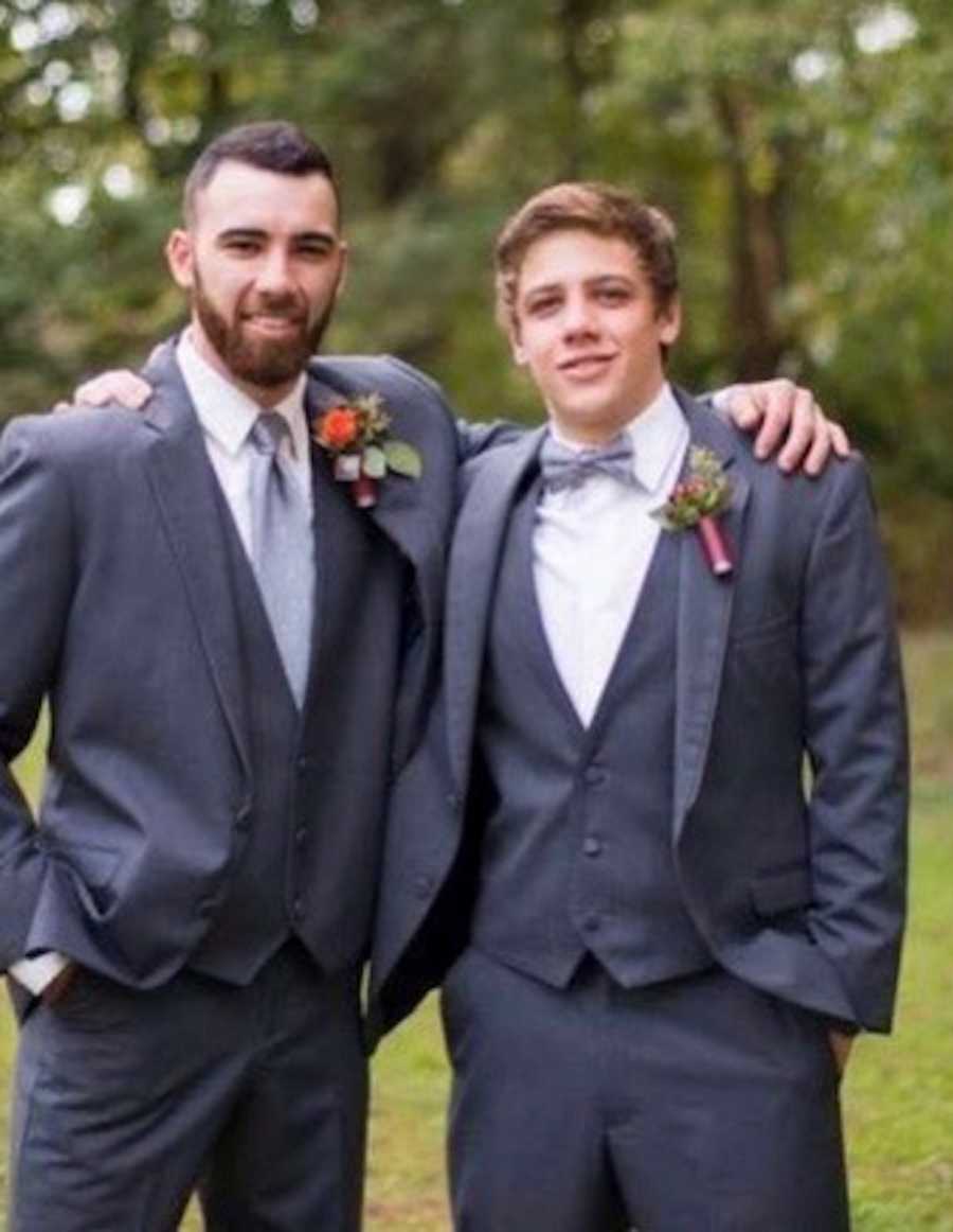 Older brother stands with arm around younger brother who died from drug overdose