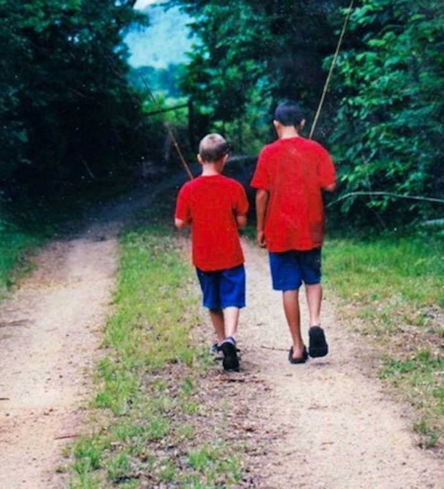 Brothers walking on dirt path when they were little and younger brother has since died from drug abuse