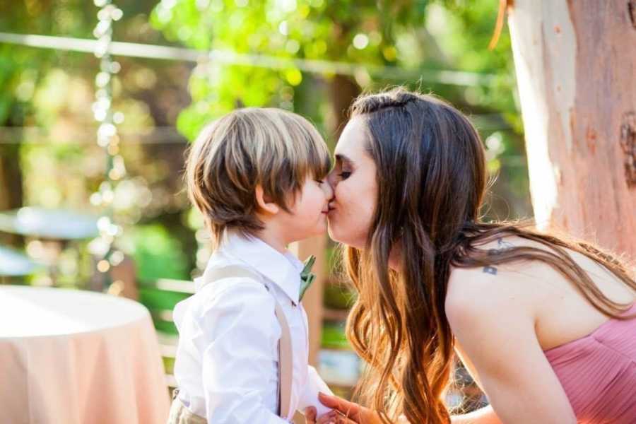 Woman who was pregnant at 19 kisses son on lips at formal event