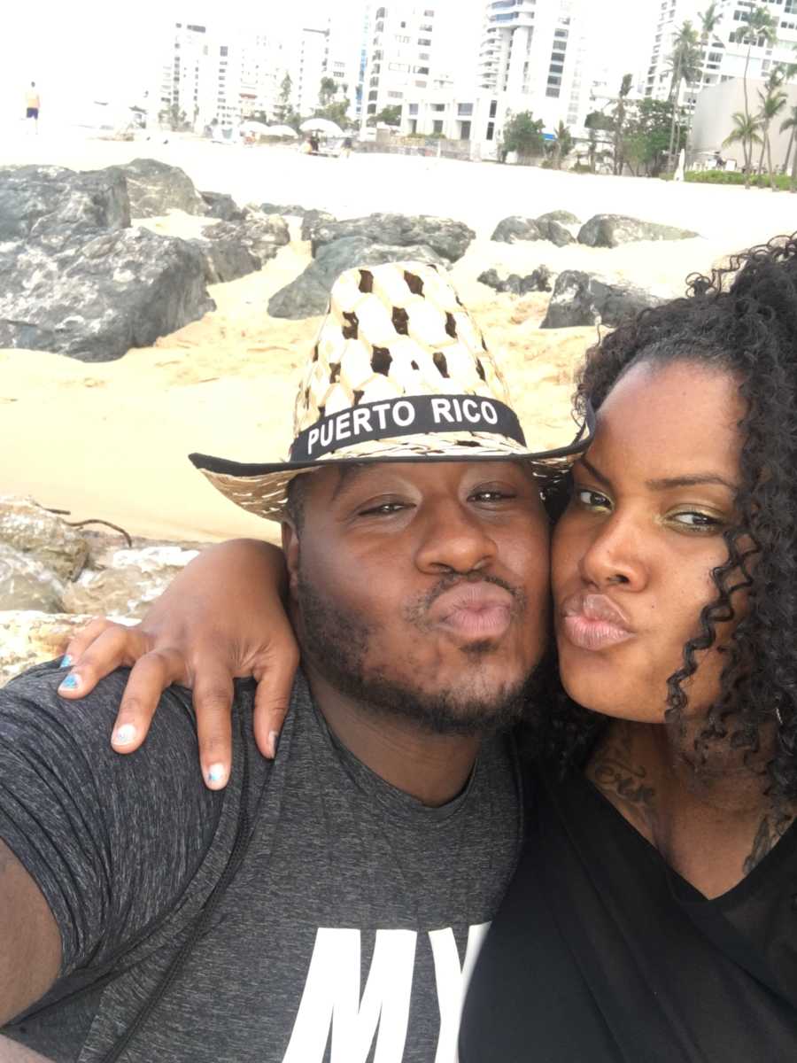 Husband and wife take selfie on beach in Puerto Rico