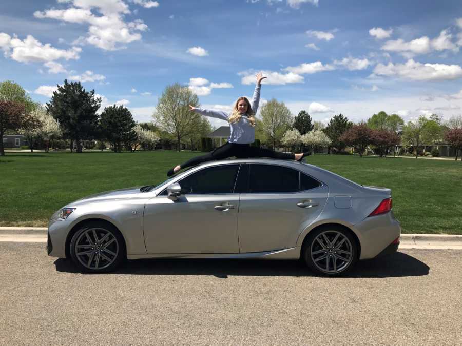 Teen does splits on top of new car