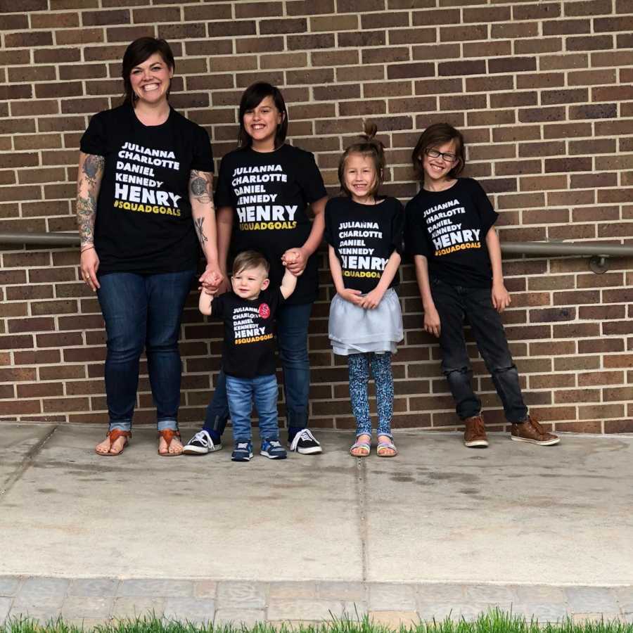 Single foster mom stands with her four children who get lots of looks out in public