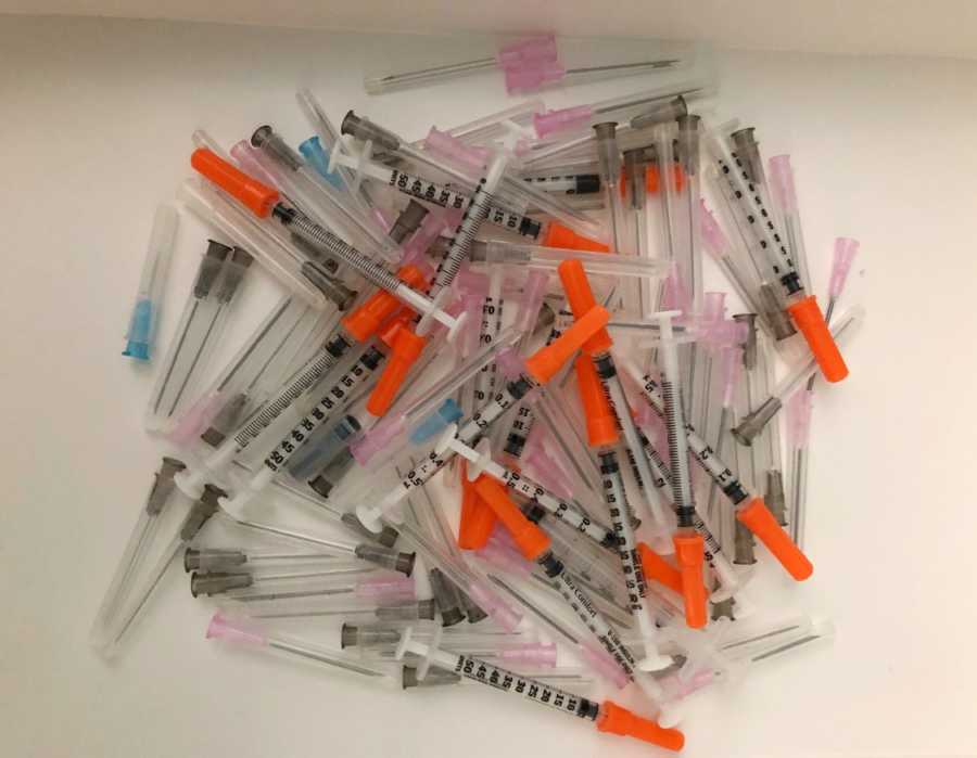 A collection of syringes for IUI injections in a pile