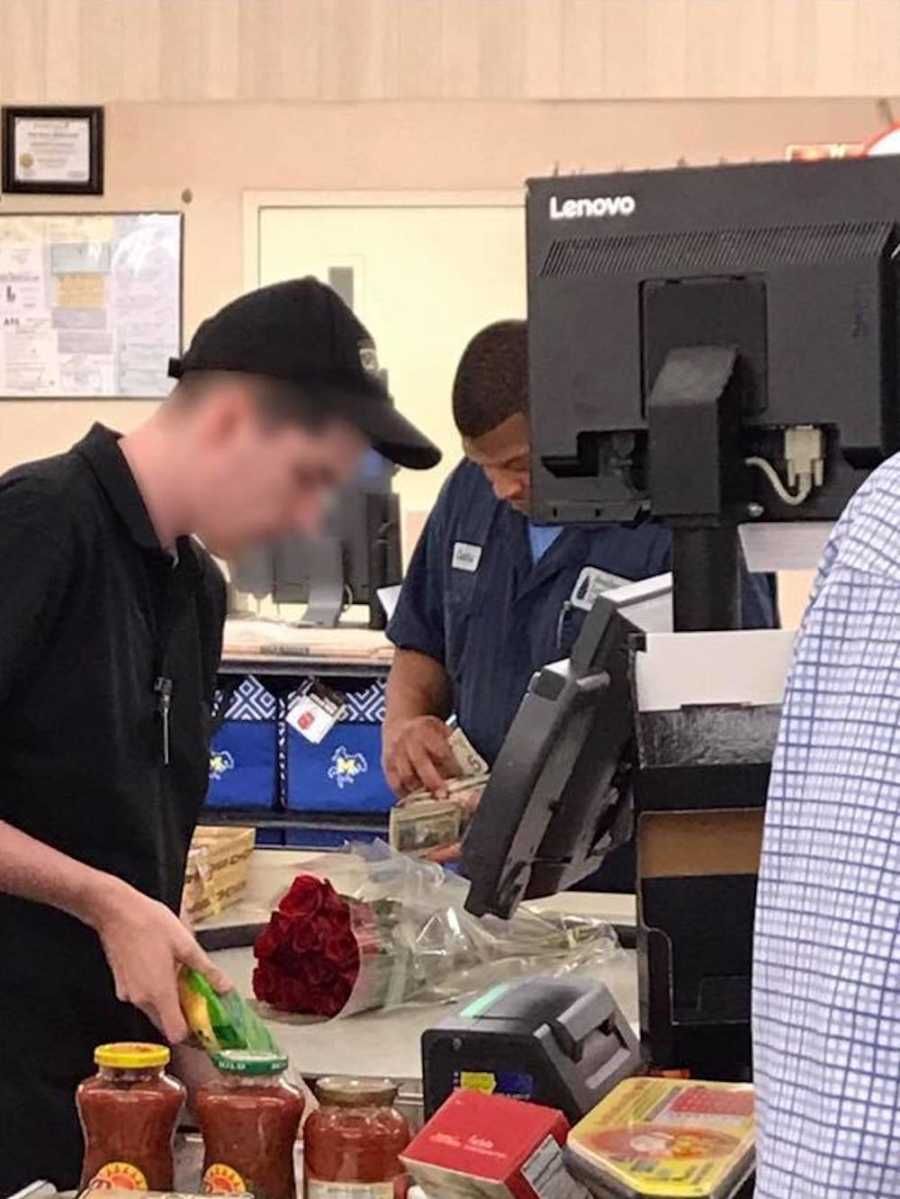 Man buys a bouquet of roses for his wife