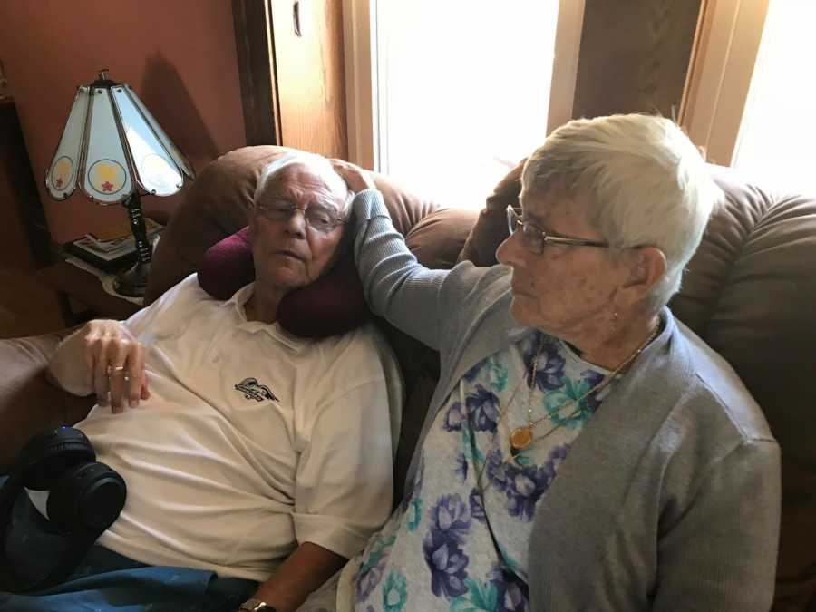 Elderly couple enjoy each other's company on the couch