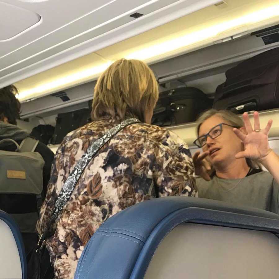 Two strangers talk to one another after woman was bullied on flight