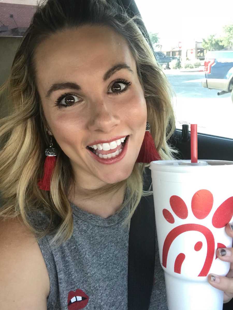 Mom takes a selfie with her Chick-fil-a cup while wearing an outfit that accidentally matches it
