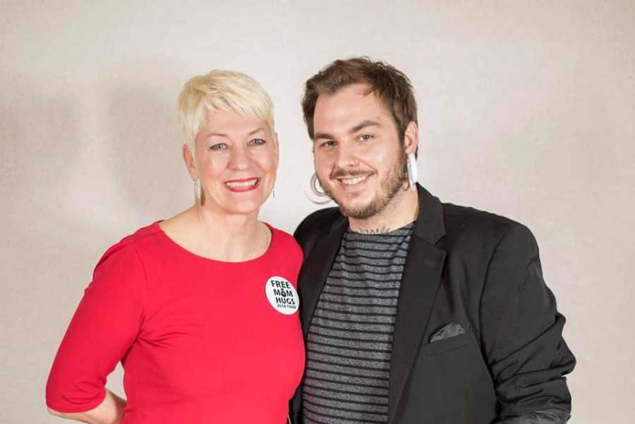 Mom and gay son take headshot photo together while wearing matching earrings