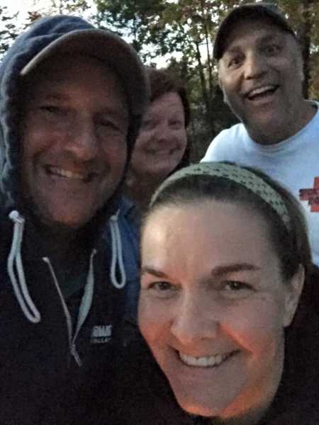 Blended family take a selfie together while enjoying a camping trip together