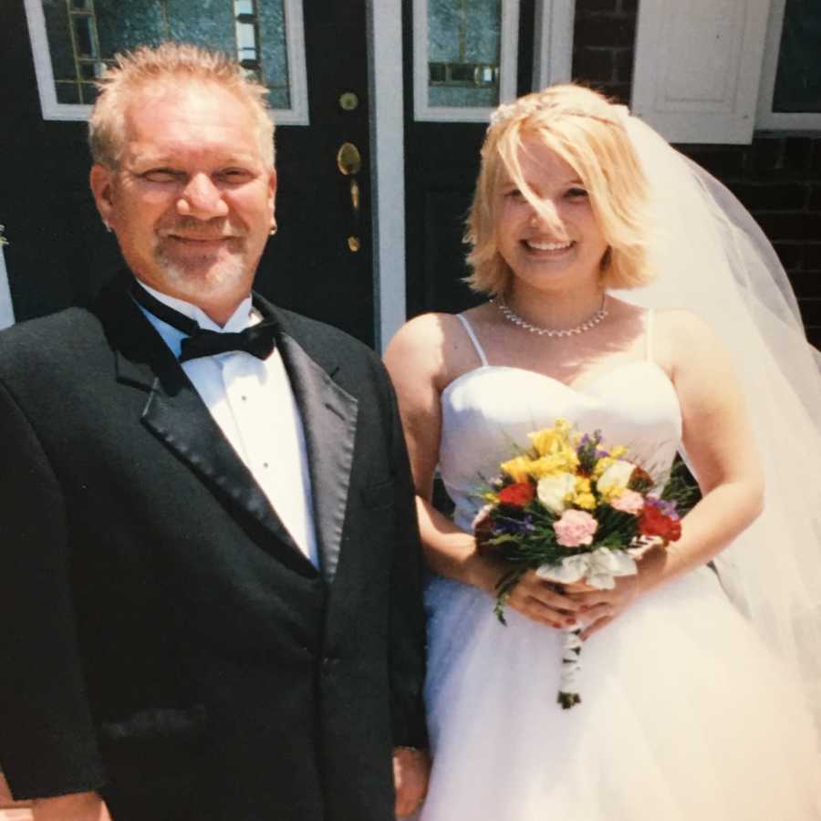 Woman stands next to her father on her wedding day