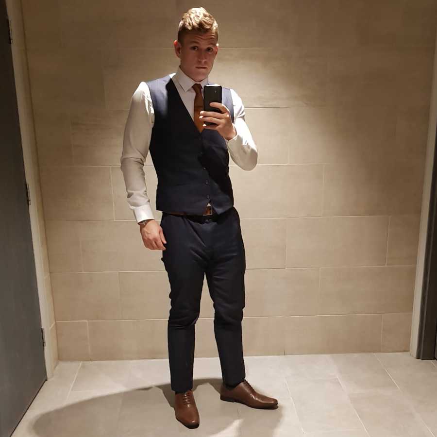 After weight loss journey, man shows off his new bod in fitted suit