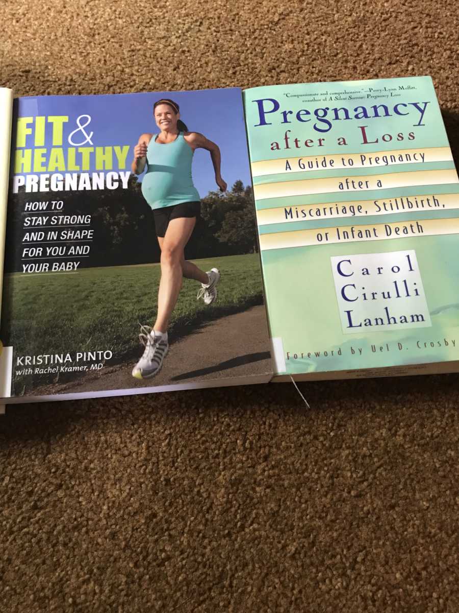 Woman takes photo of pregnancy books