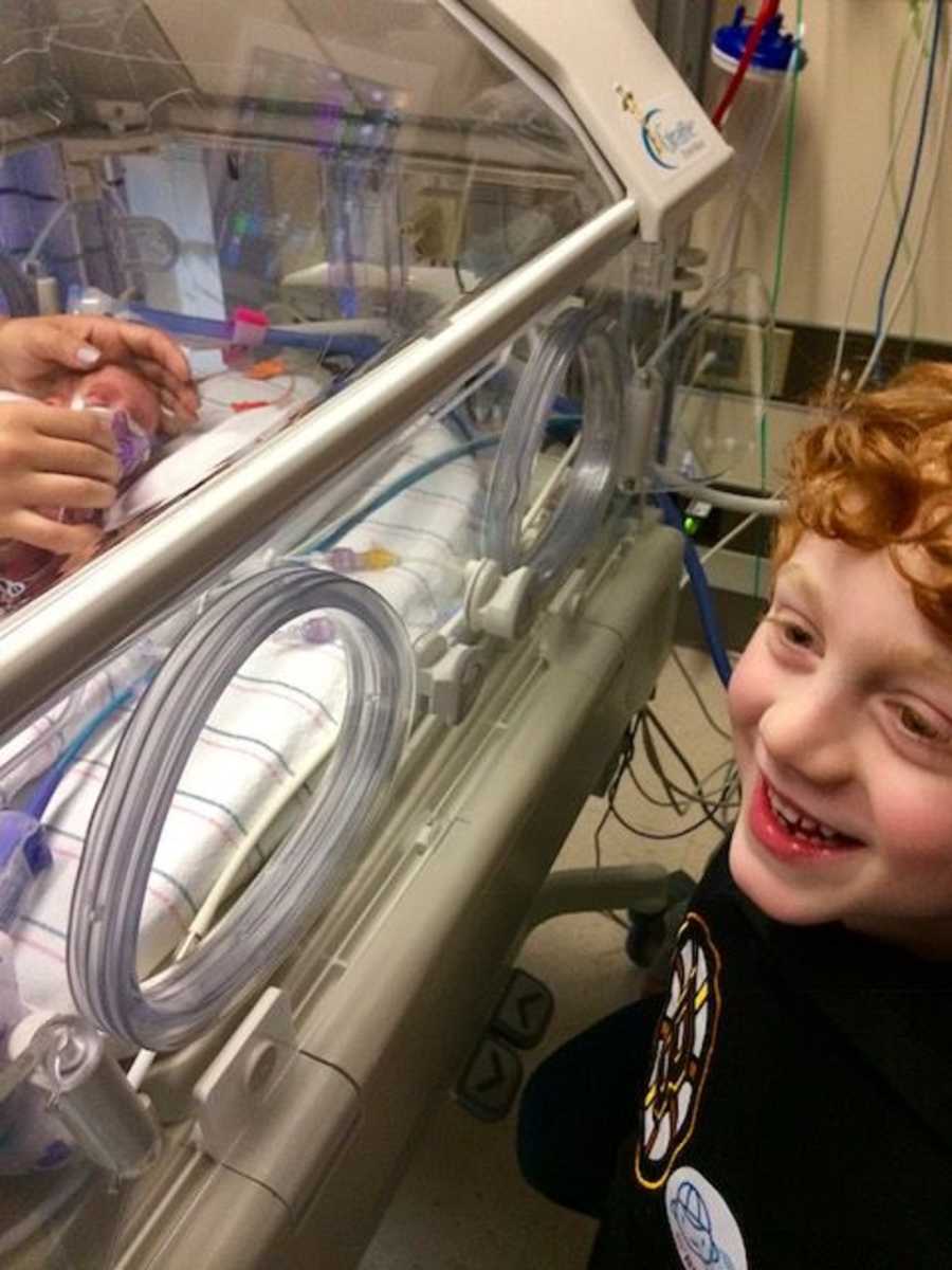 Big brother meets his newborn sibling for the first time in the NICU