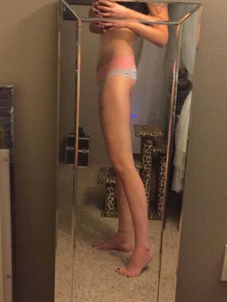 Woman battling meth addiction takes a mirror selfie, showing how skinny she has become