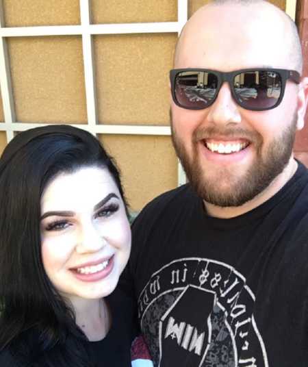 Couple take selfie together while enjoying outdoor activities 