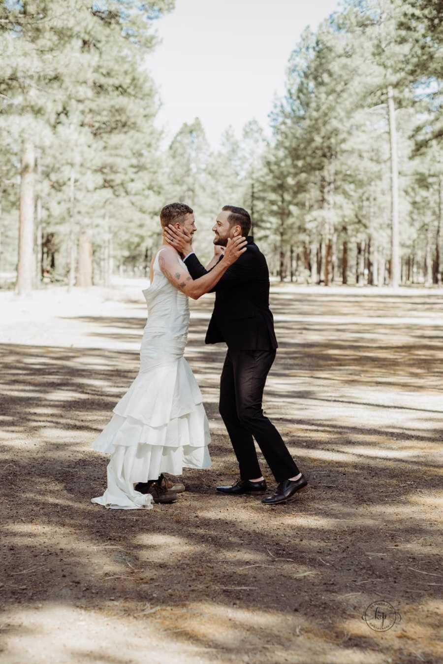 Groom and best man laughing while embracing