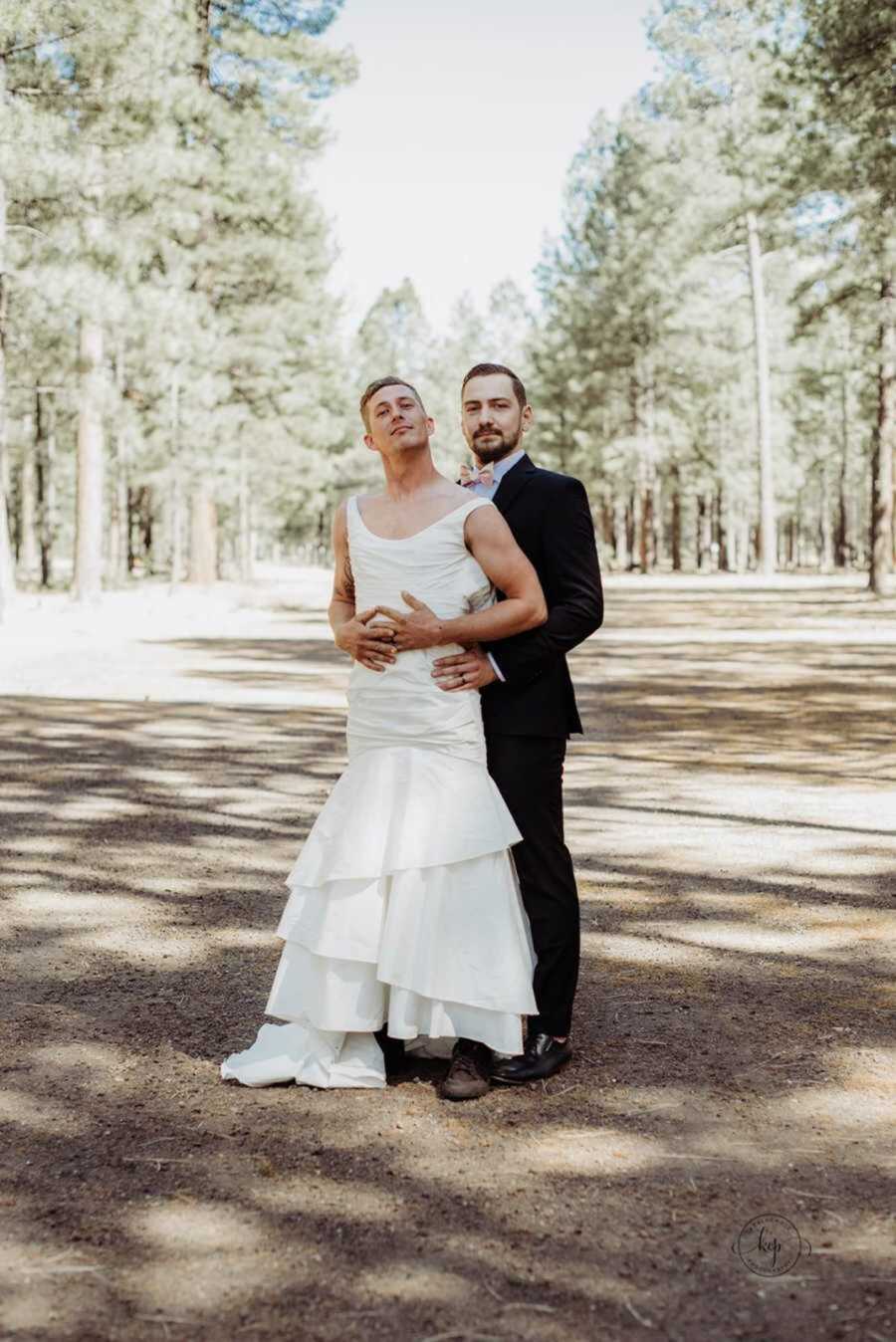 Groom holding best man's waist