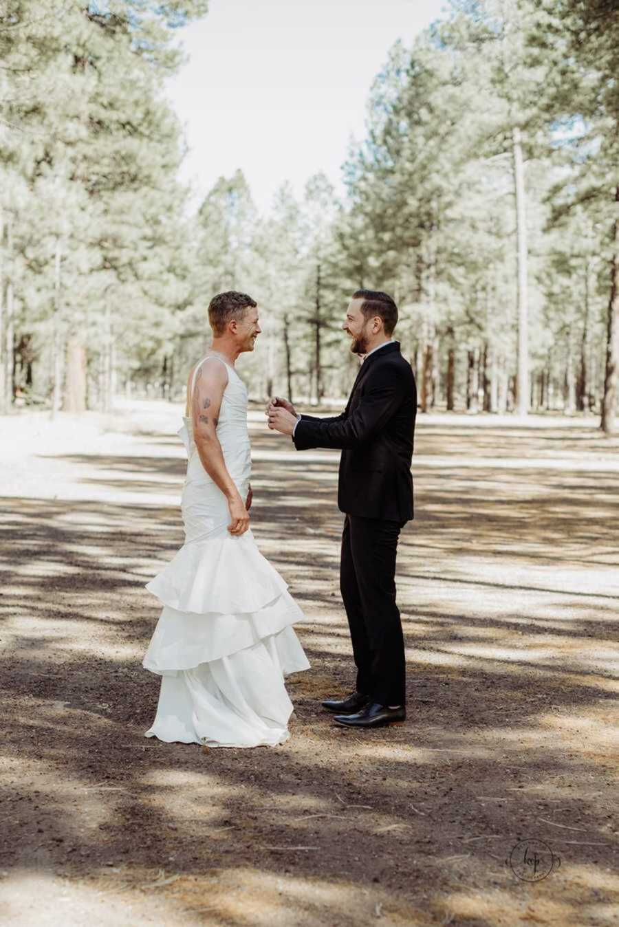 Groom and best man laughing