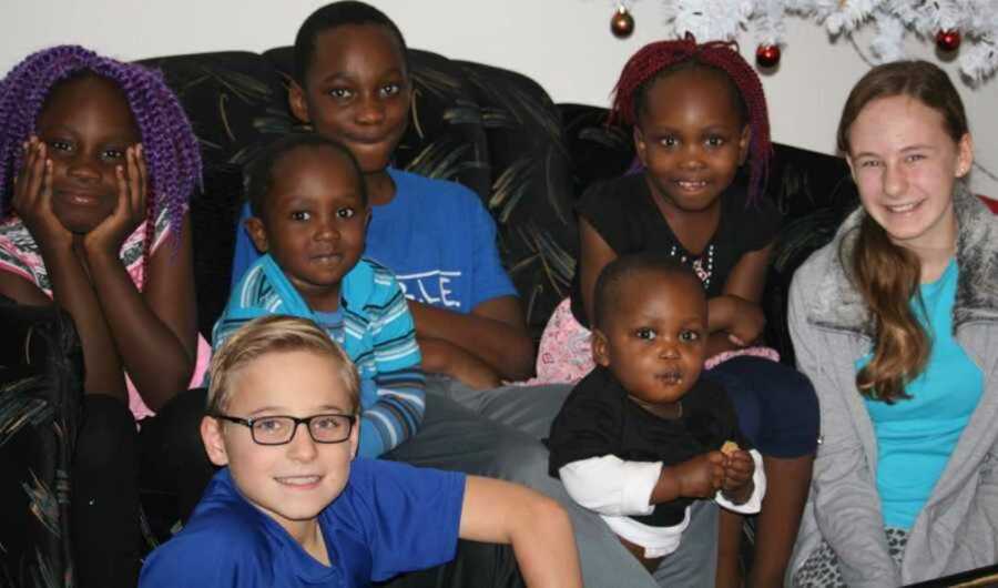 Foster and biological families reunite on black couch