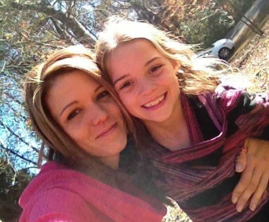 Mom and daughter take a selfie in the park