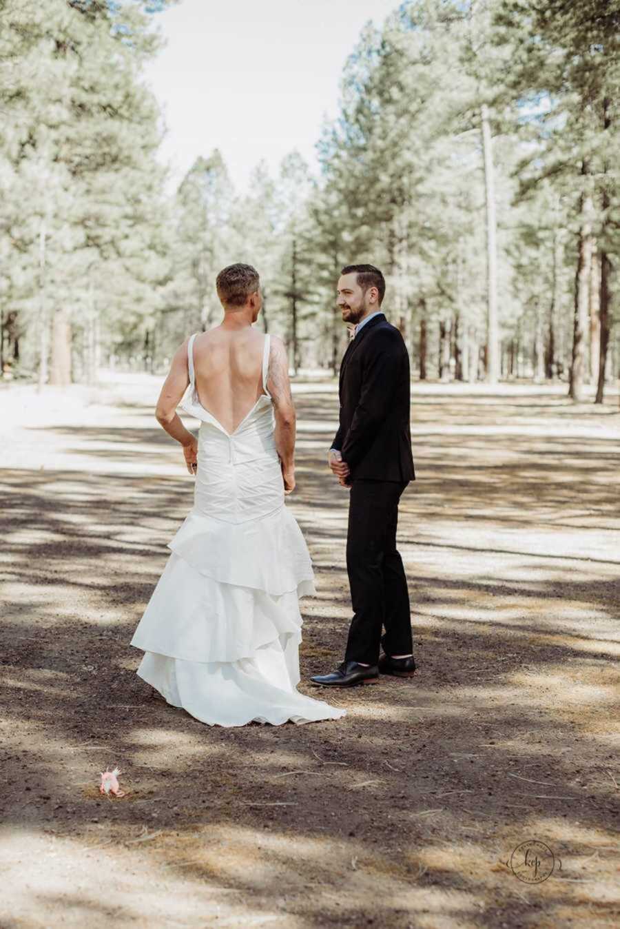 Groom spotting man in bride's wedding dress