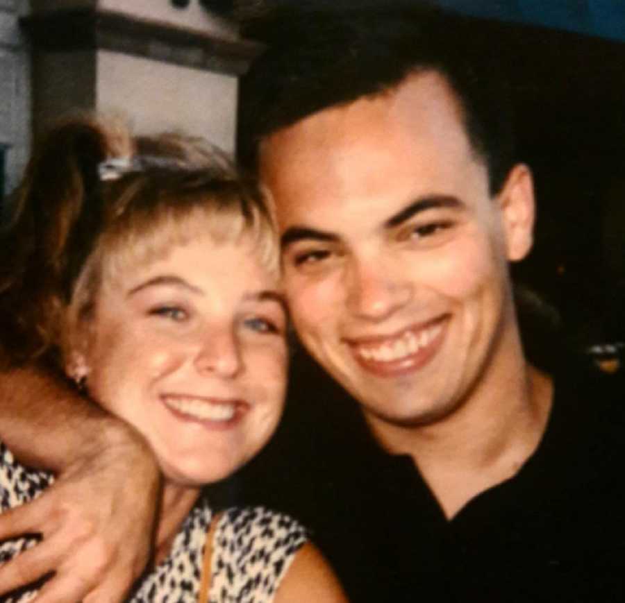 Husband smiling with arm around wife who has since passed away