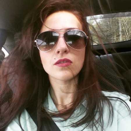 Daughter with eating disorder wearing sunglasses in selfie in car 