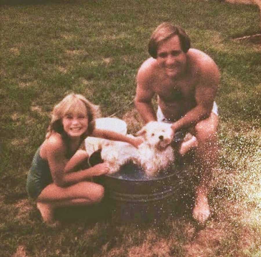 Woman who was youngest girl to ever receive hysterectomy washes small dog in bucket with father 