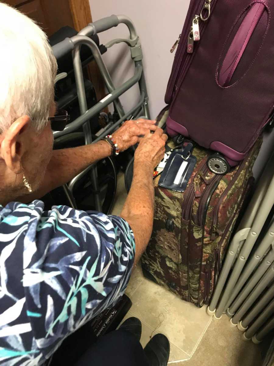 Woman with dementia stacking her suitcases as she says it's the way she wants them