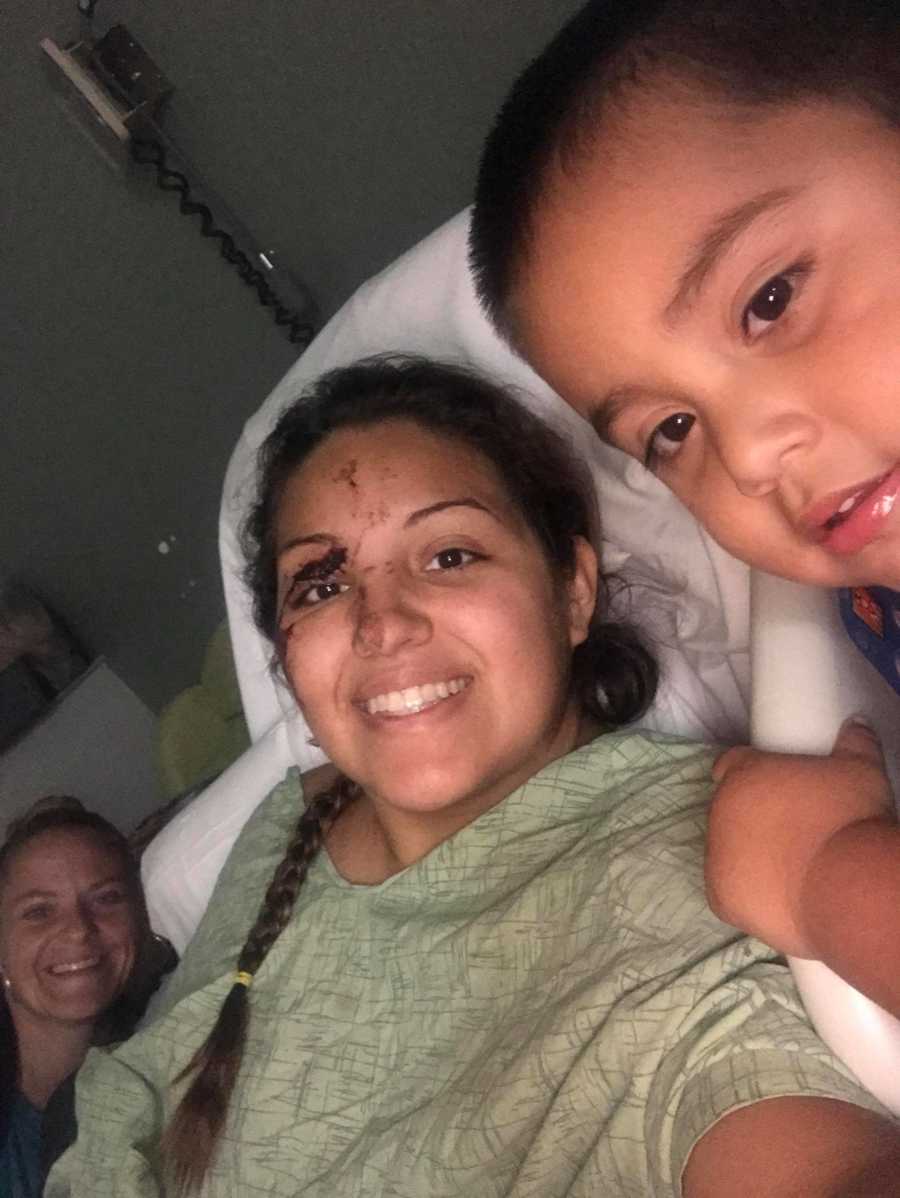 Woman recovering from a near-fatal car accident takes a selfie in the hospital with her son and friend
