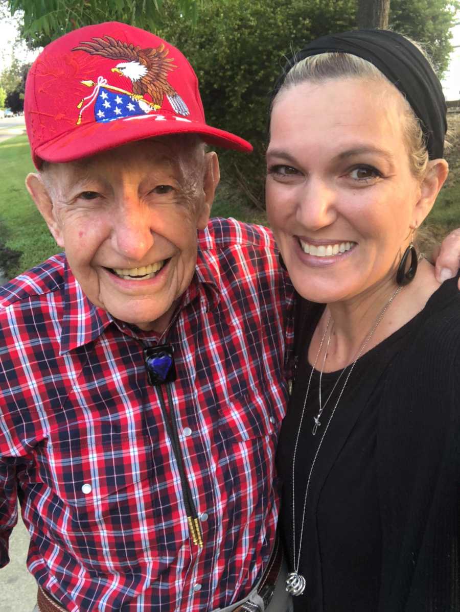 Mother smiles in selfie with old man who stands outside her child's middle school to encourage kids