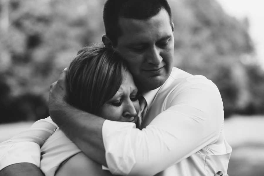 Groom hugs mother with breast cancer
