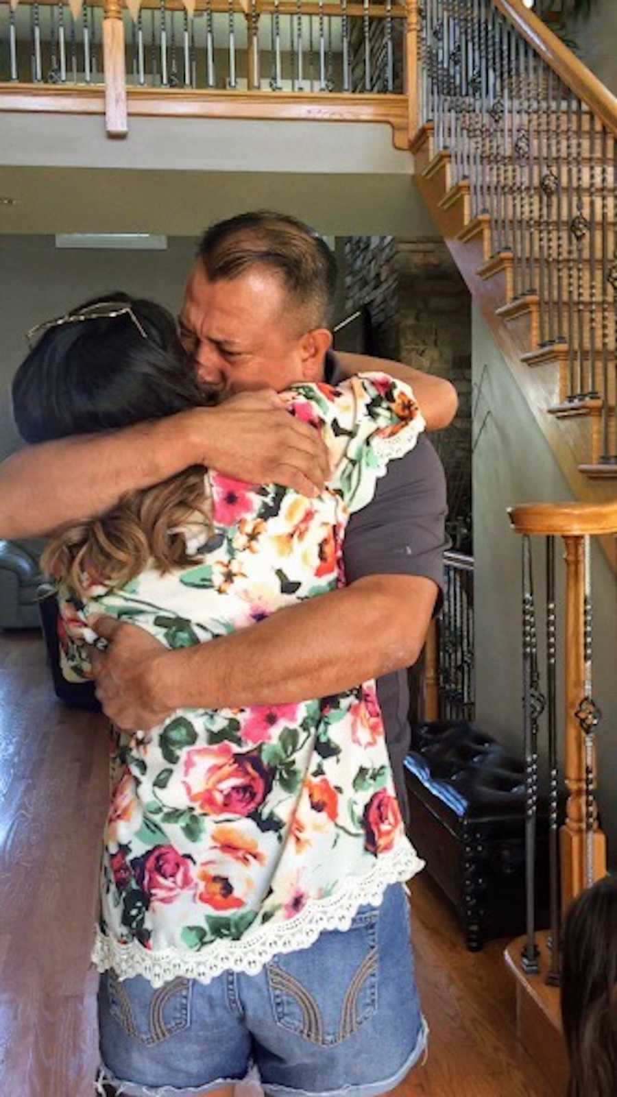 Woman hugs father that had her as a teen and gave her up for adoption