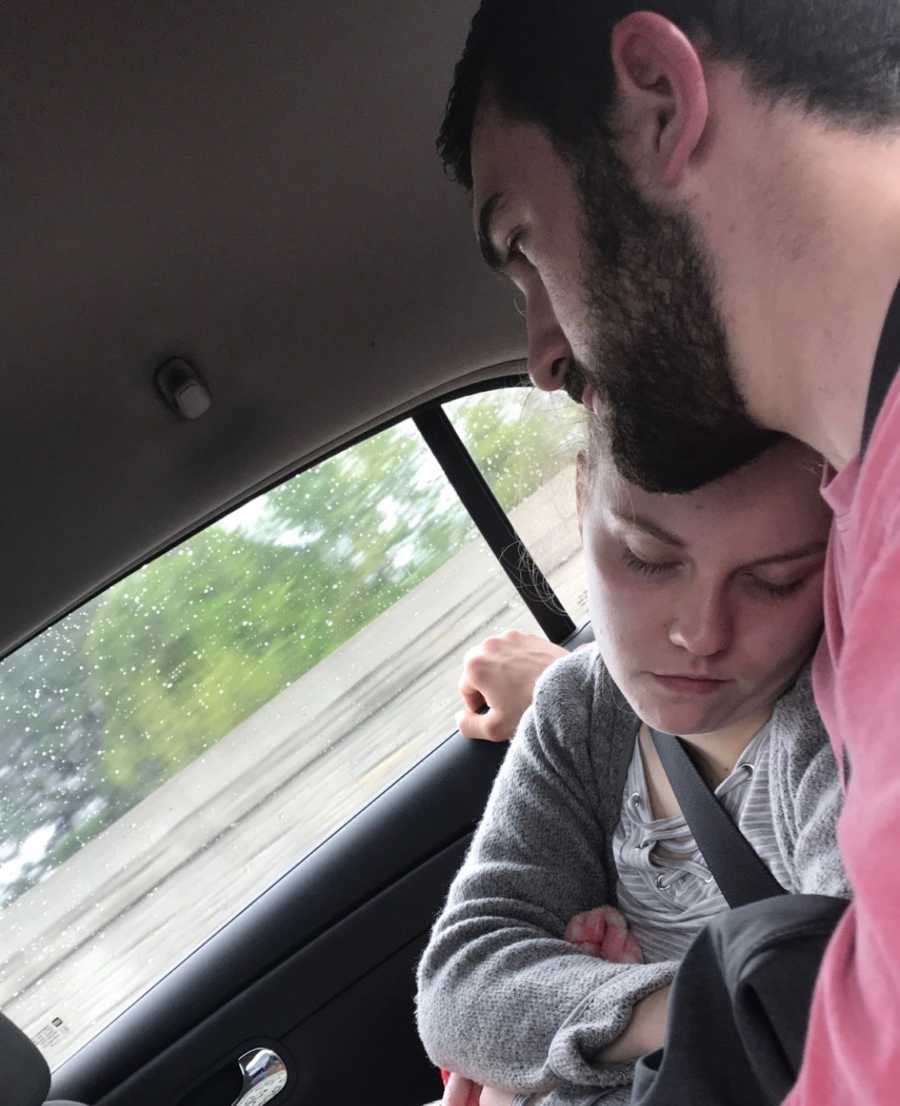 Teen with undiagnosed issues sleeping in car with head on shoulder of boyfriend